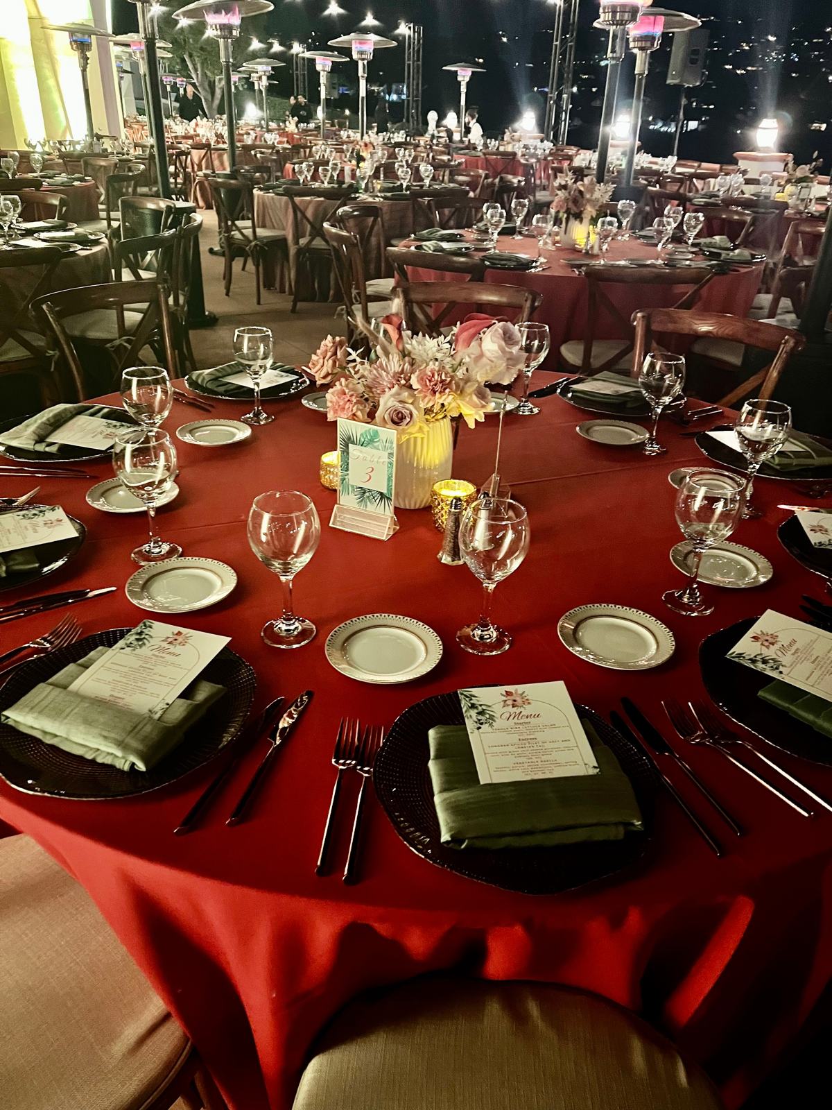 Gala dinner with red linens and gold place settings