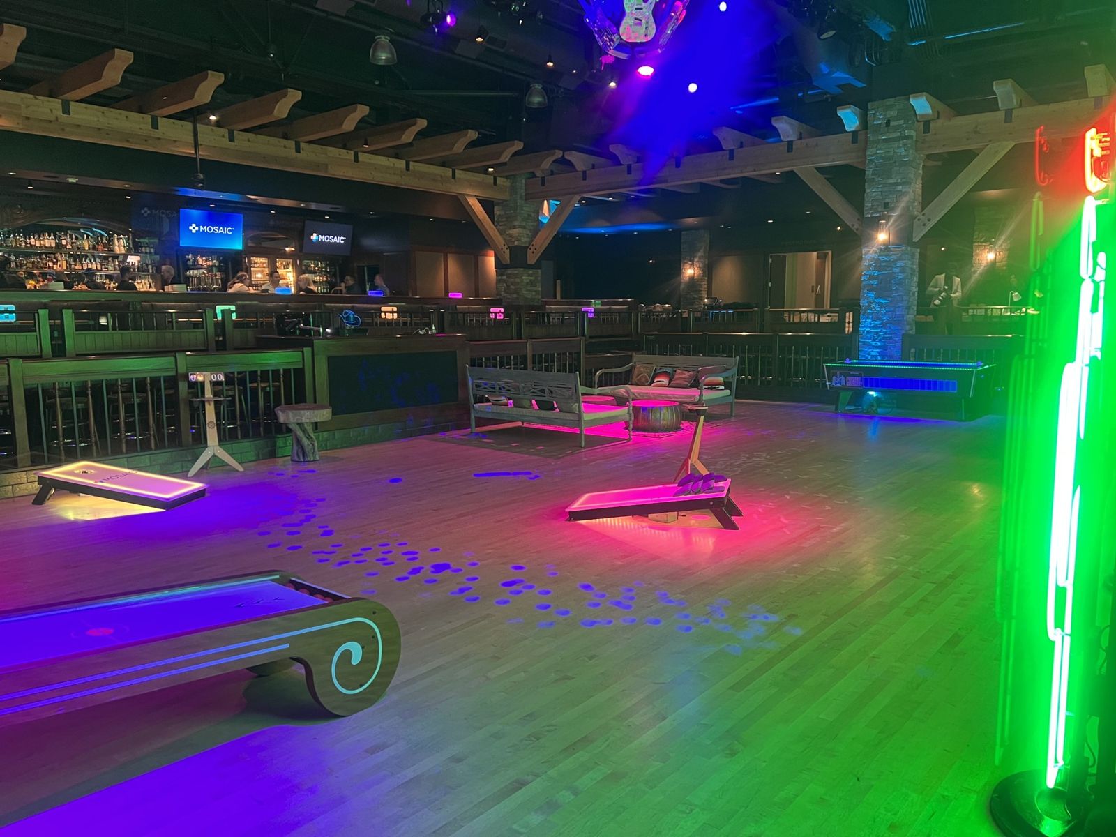 Neon-lit bar and dance floor ready for guests