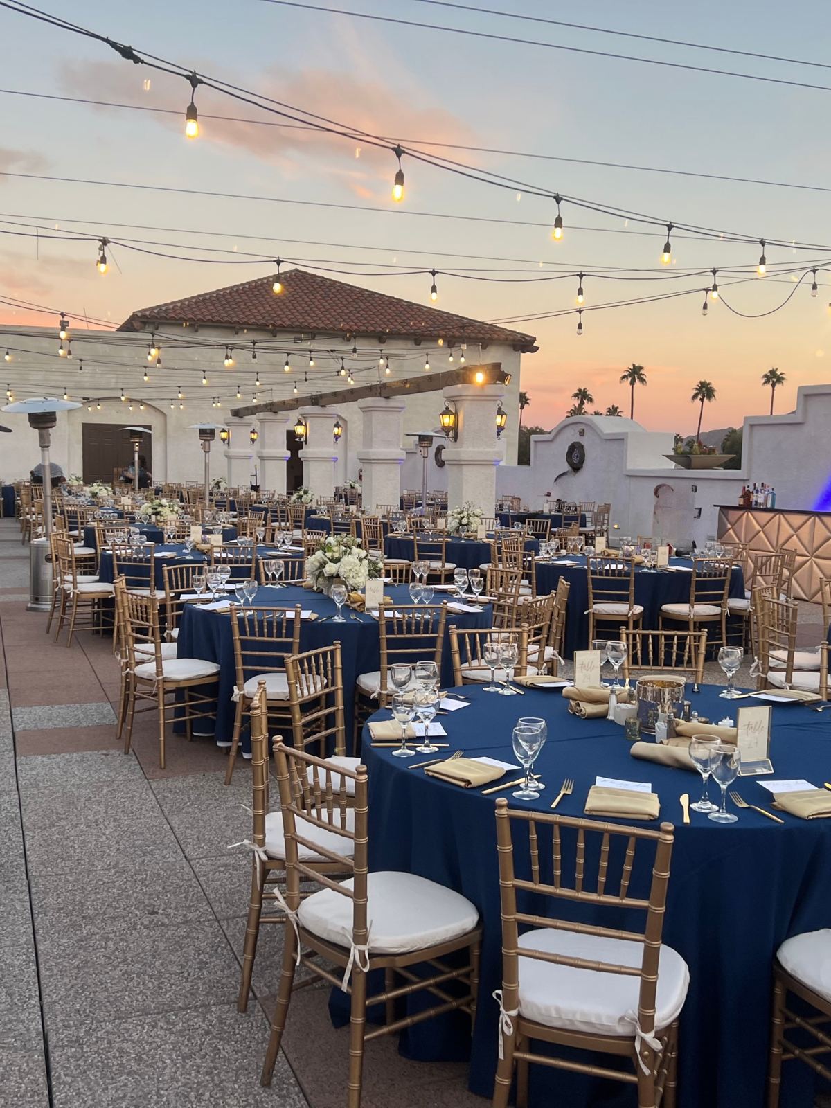 Resort terrace set for a multi-day conference dinner